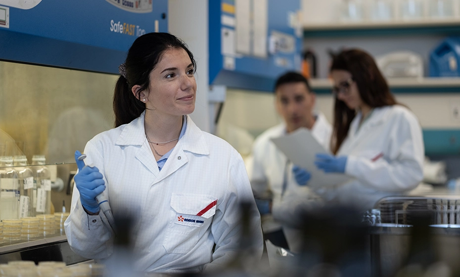 chemical analyst with a test tube in the Rivoli laboratory