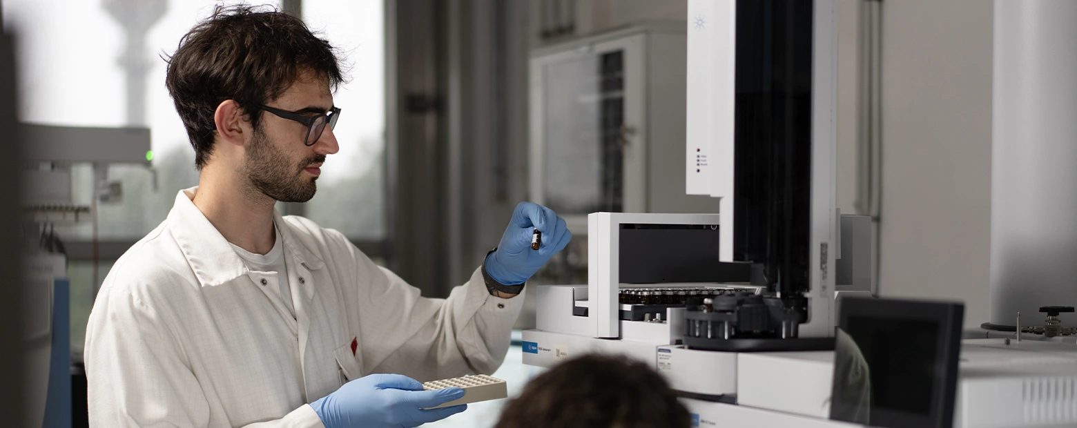 a chemist analyses samples with a machine in the Rivoli laboratory